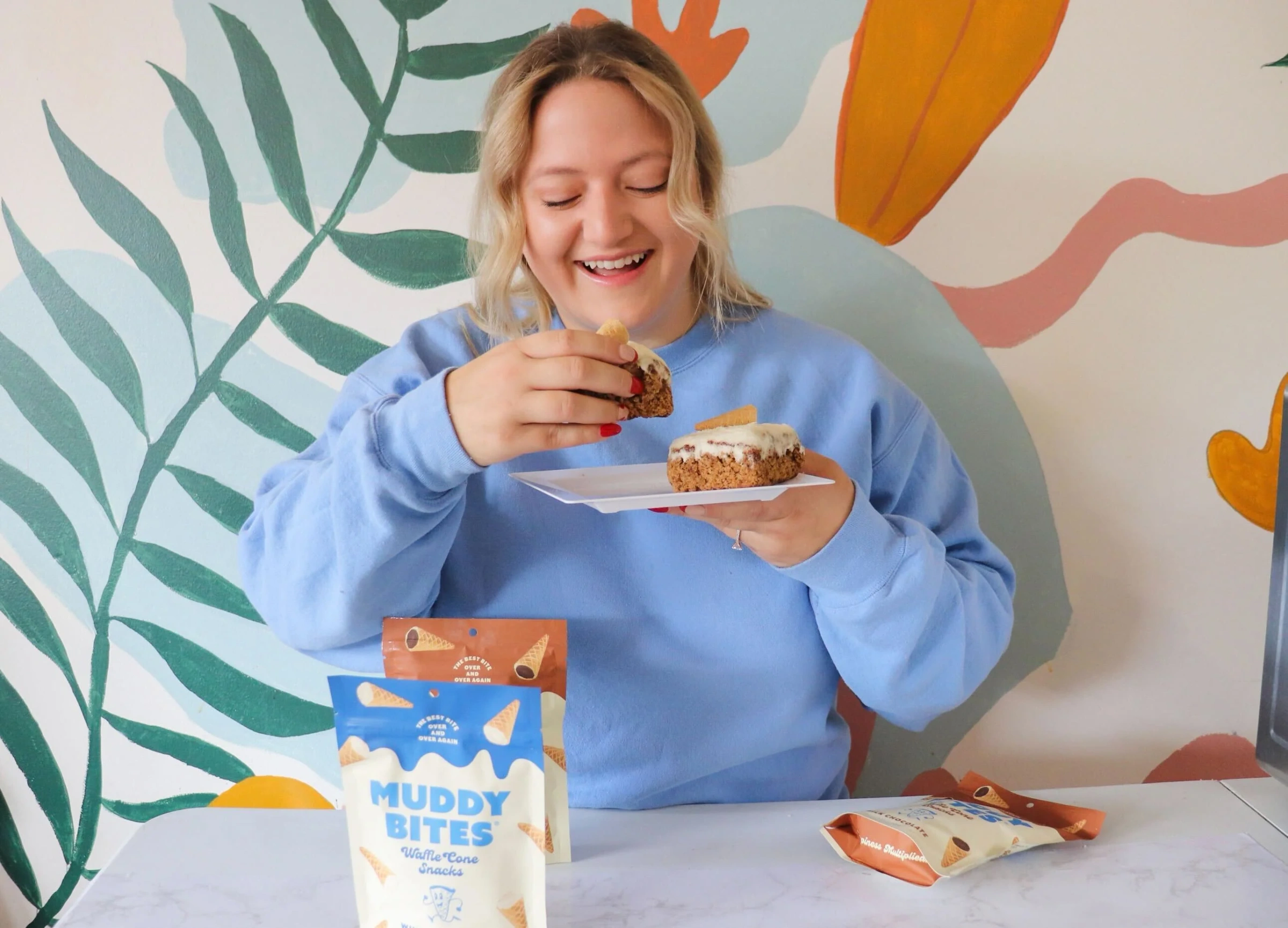 A woman grabs a bite of Pumpkin Sheet Cake.